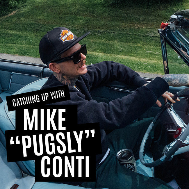 Mike Pugsly driving a convertible car