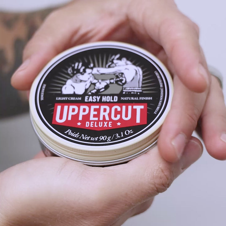 Uppercut Deluxe Easy Hold tin being opened, scooped and spread through hands.